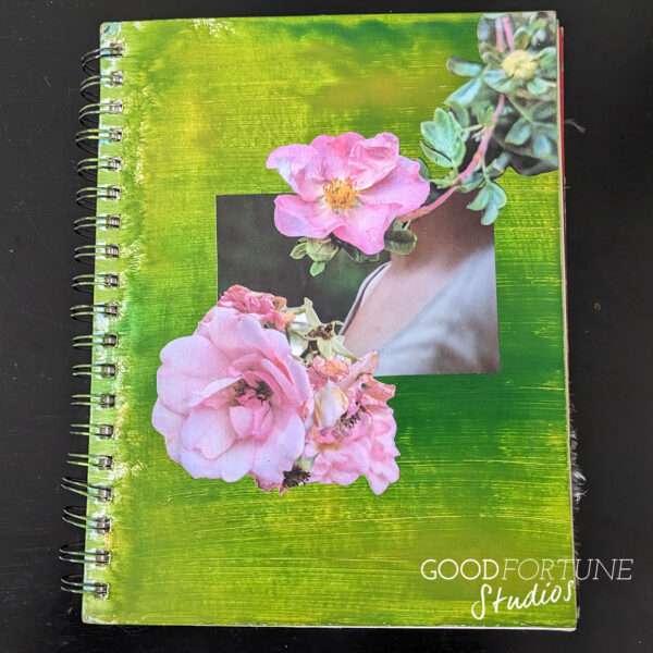 Cover of art journal - dark green background with two pink flowers