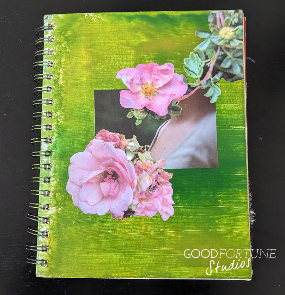 Cover of art journal - dark green background with two pink flowers